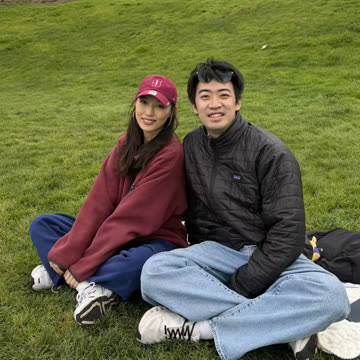 The two of us sitting on a grassy hill